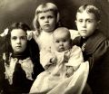 Martha, Marian, Dorothy (infant) and Paul Daggett, about 1901